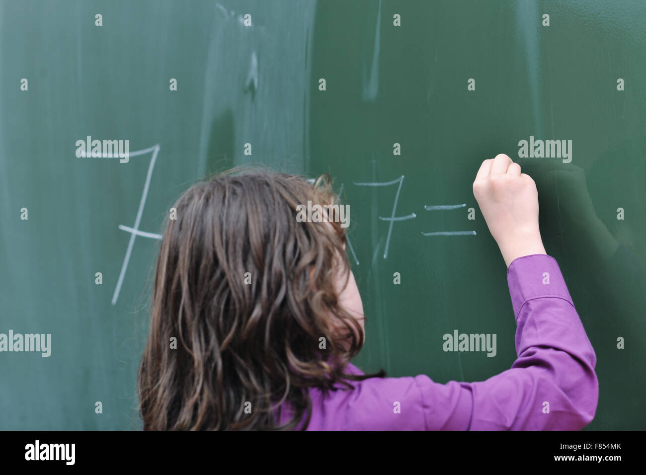 happy school girl on math classes finding solution and solving problems ...