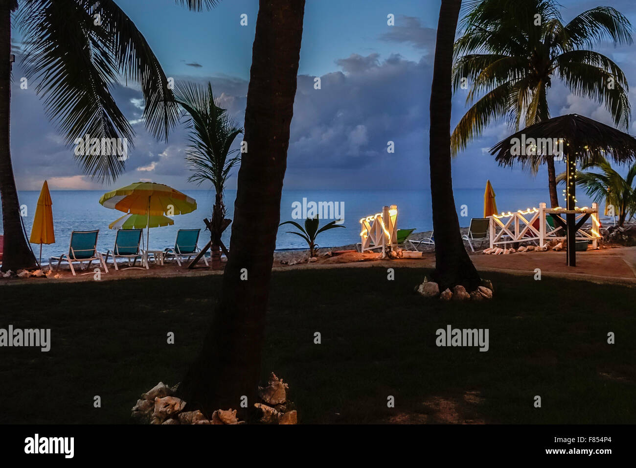 A beachside resort showing the Caribbean at dusk. St. Croix, U.S. Virgin Islands. Cottages by the Sea resort. Stock Photo