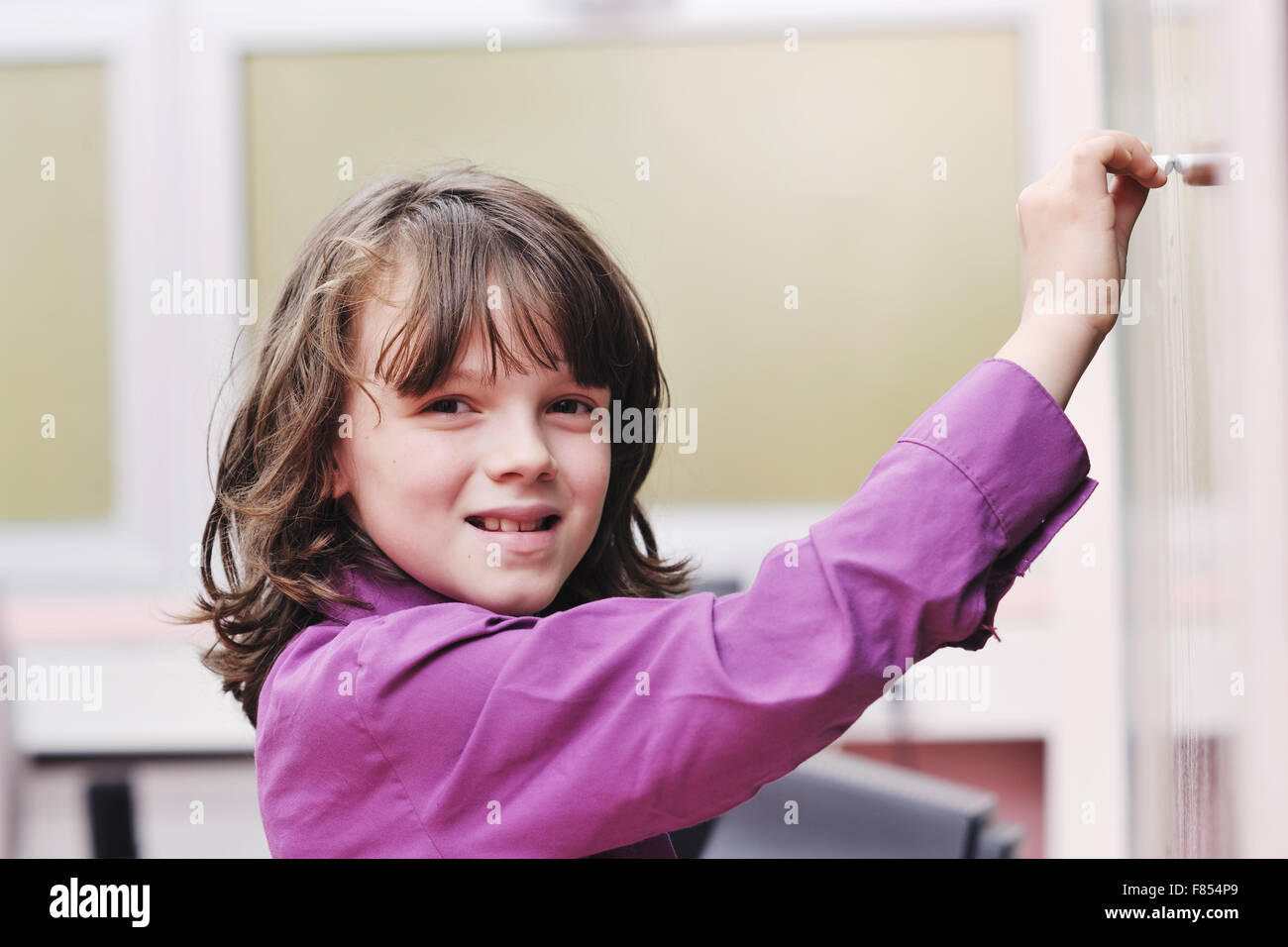 happy school girl on math classes finding solution and solving problems Stock Photo