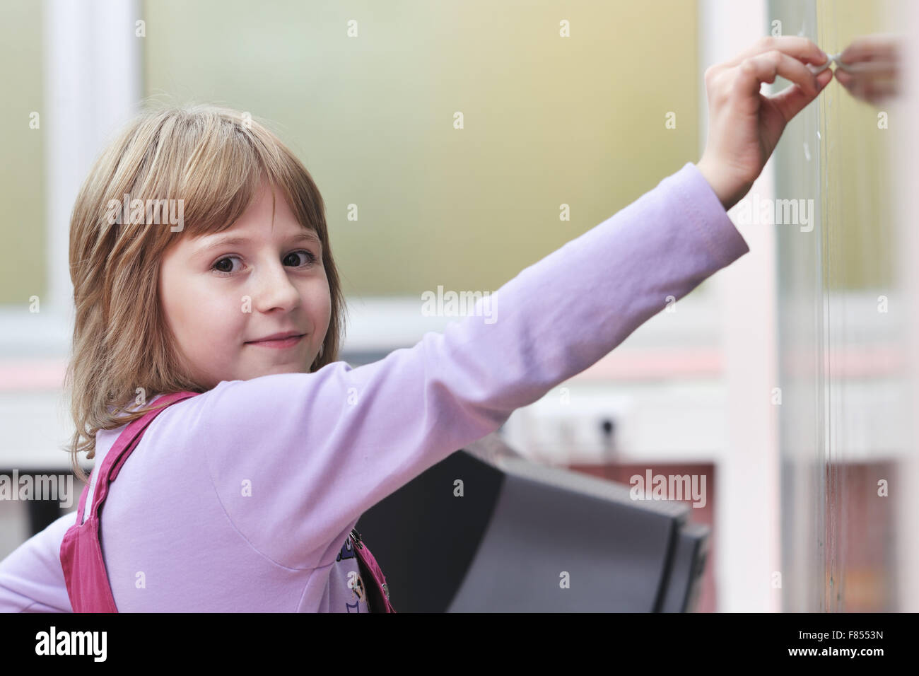 happy school girl on math classes finding solution and solving problems ...