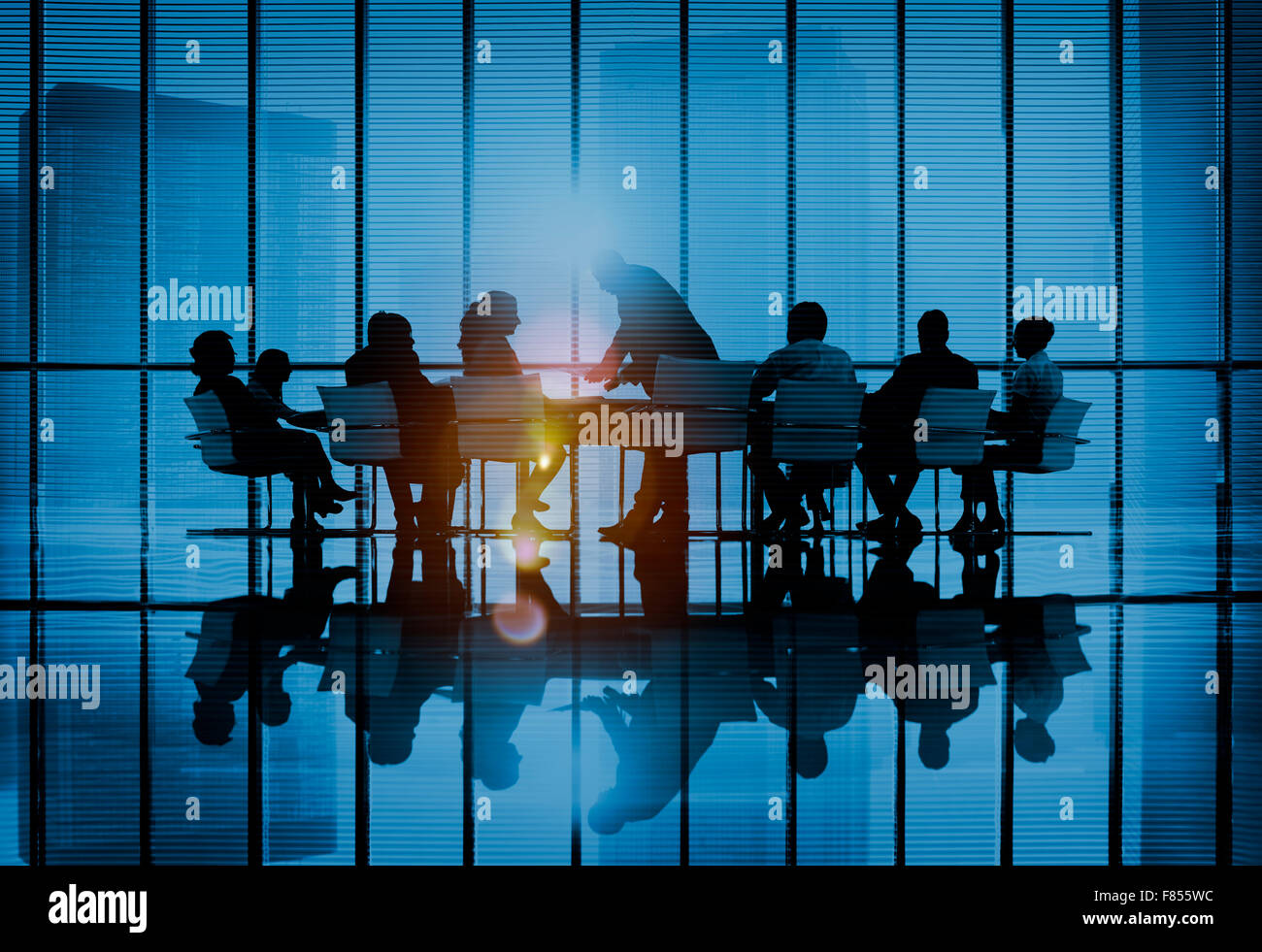 Silhouettes of business people in a conference room Concept Stock Photo ...