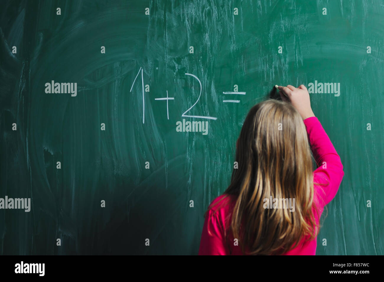 happy school girl on math classes finding solution and solving problems ...