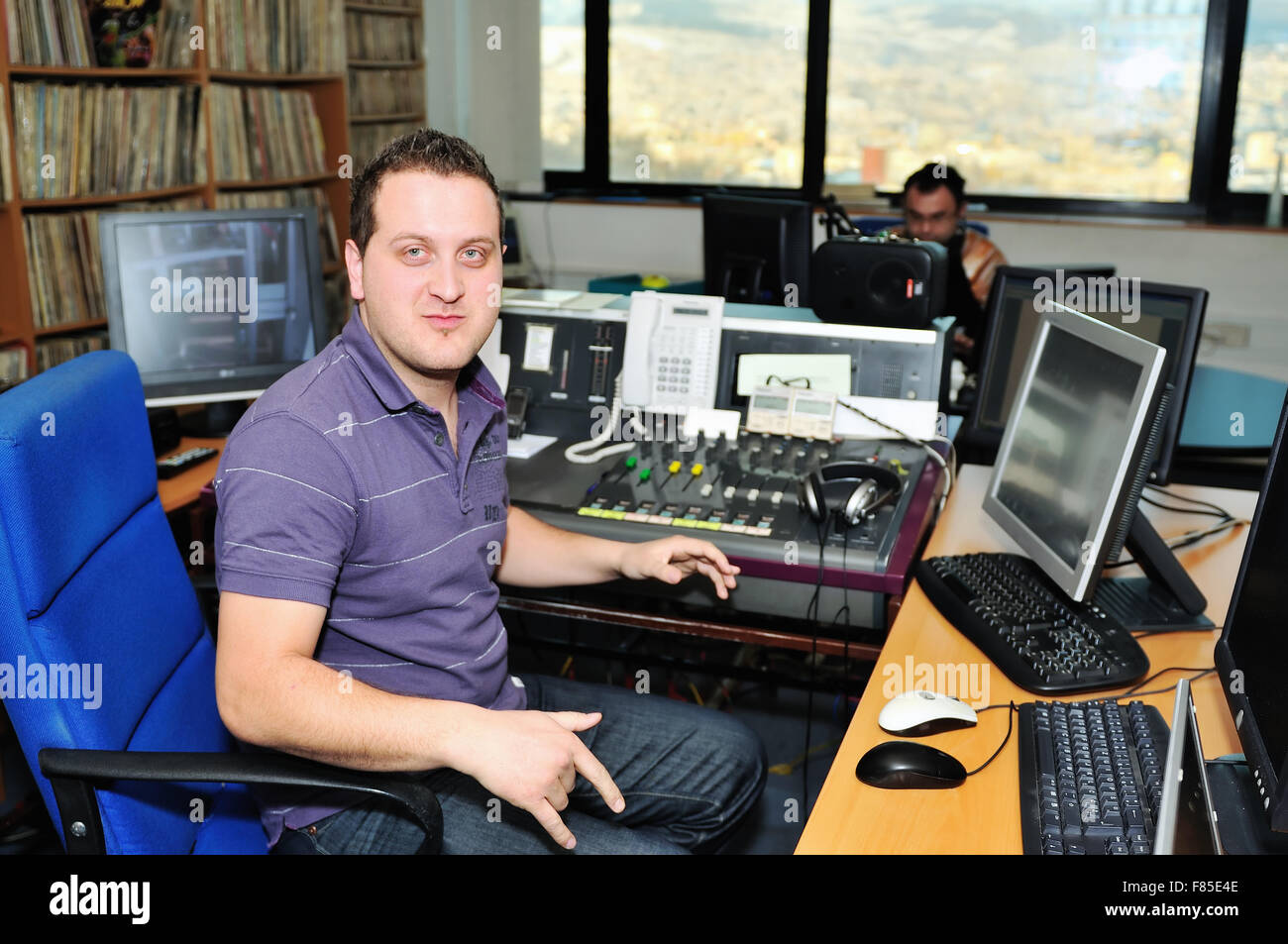 radio station dj reading news and info Stock Photo - Alamy
