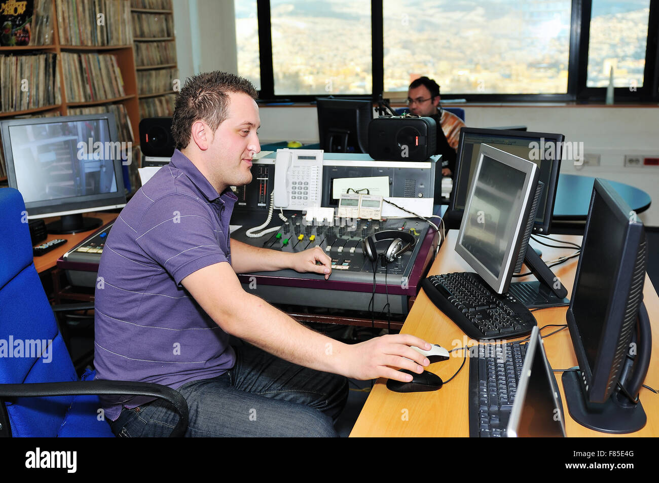 radio station dj reading news and info Stock Photo Alamy