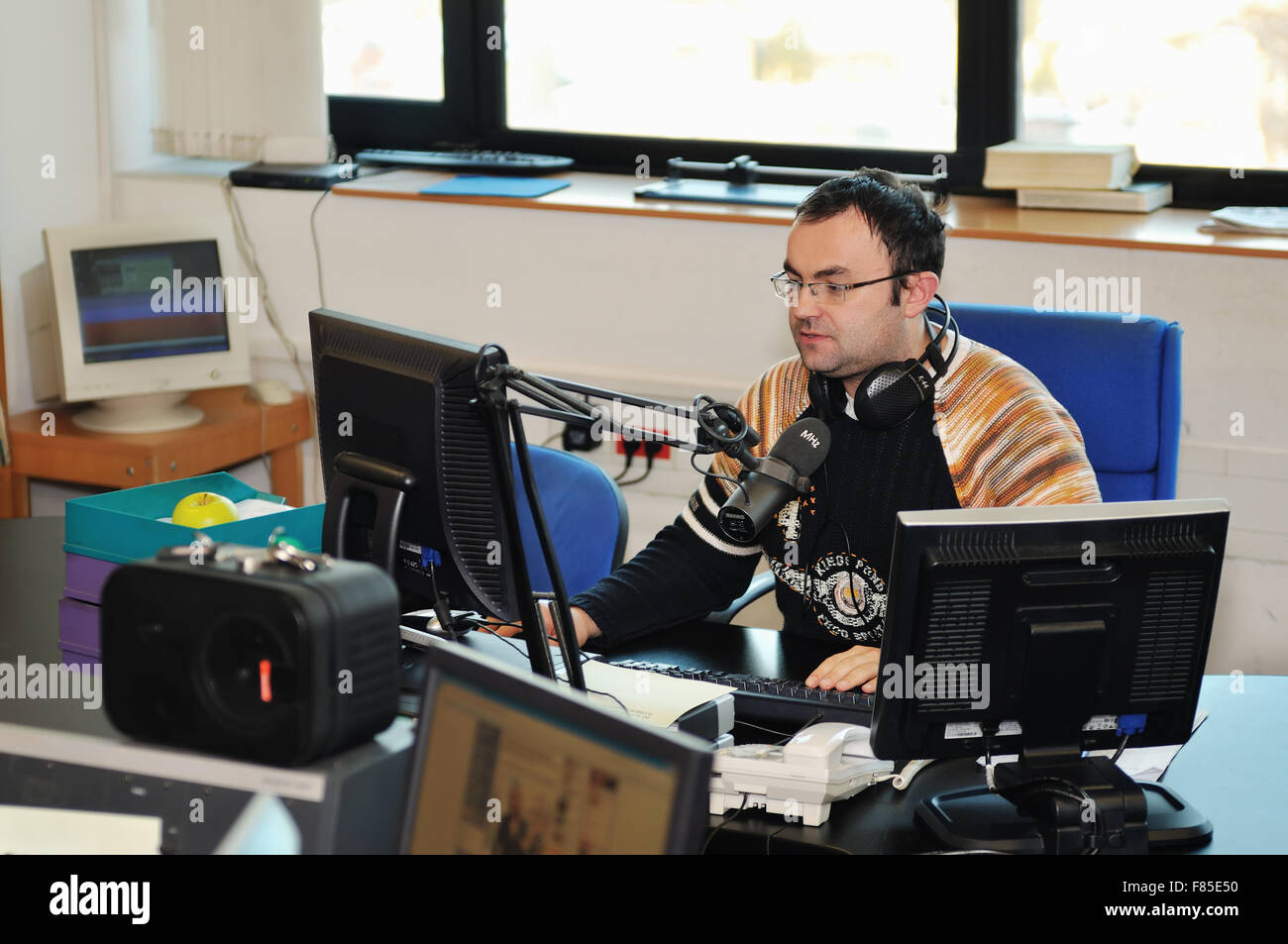 radio station dj reading news and info Stock Photo - Alamy