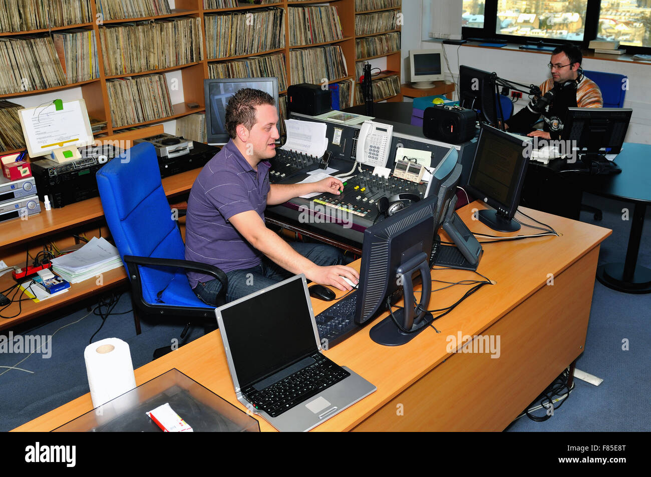 radio station dj reading news and info Stock Photo - Alamy