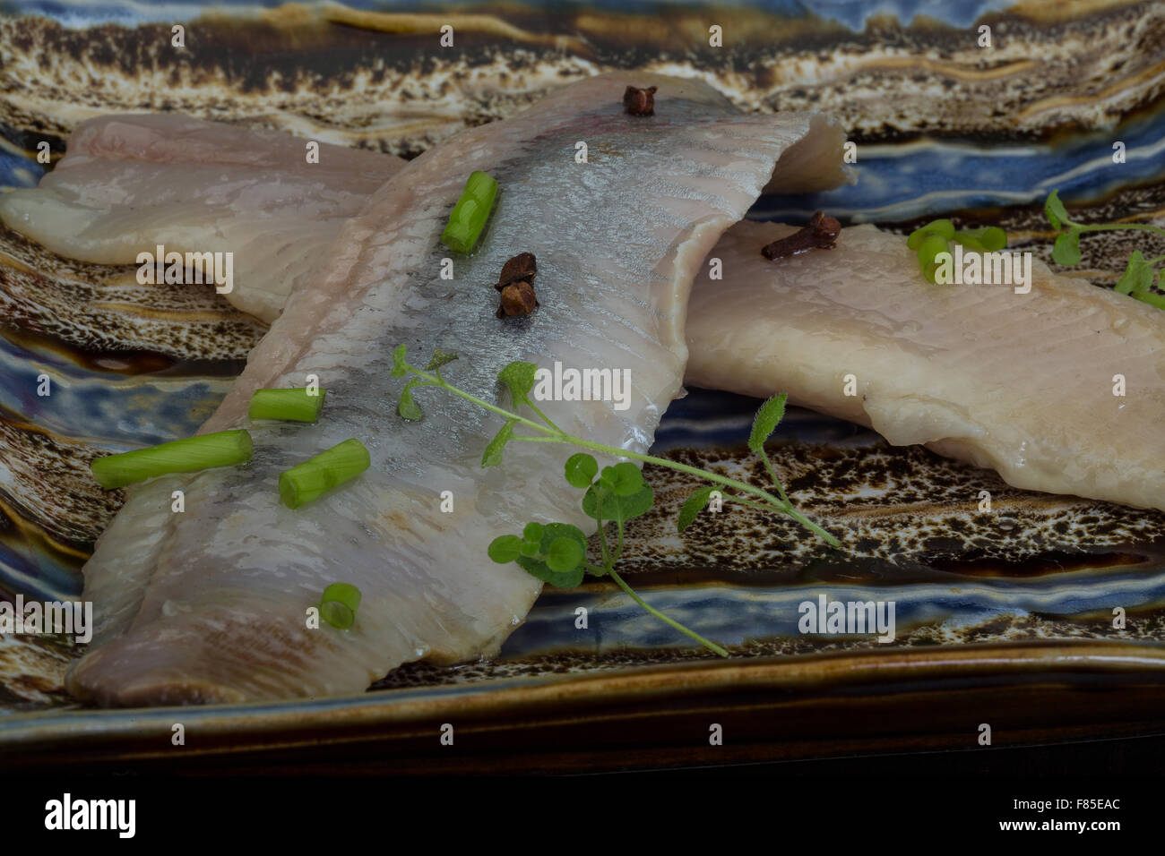 Herring fillet with herbs and spyces in the bowl Stock Photo Alamy