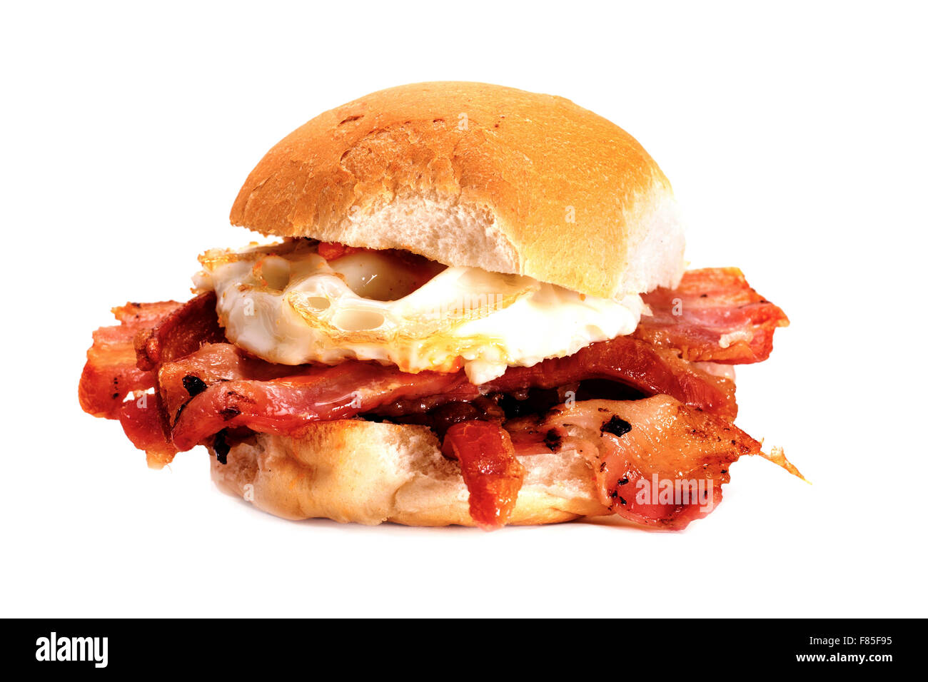 A delicious bacon and egg bun on a white background. Bacon and egg bun