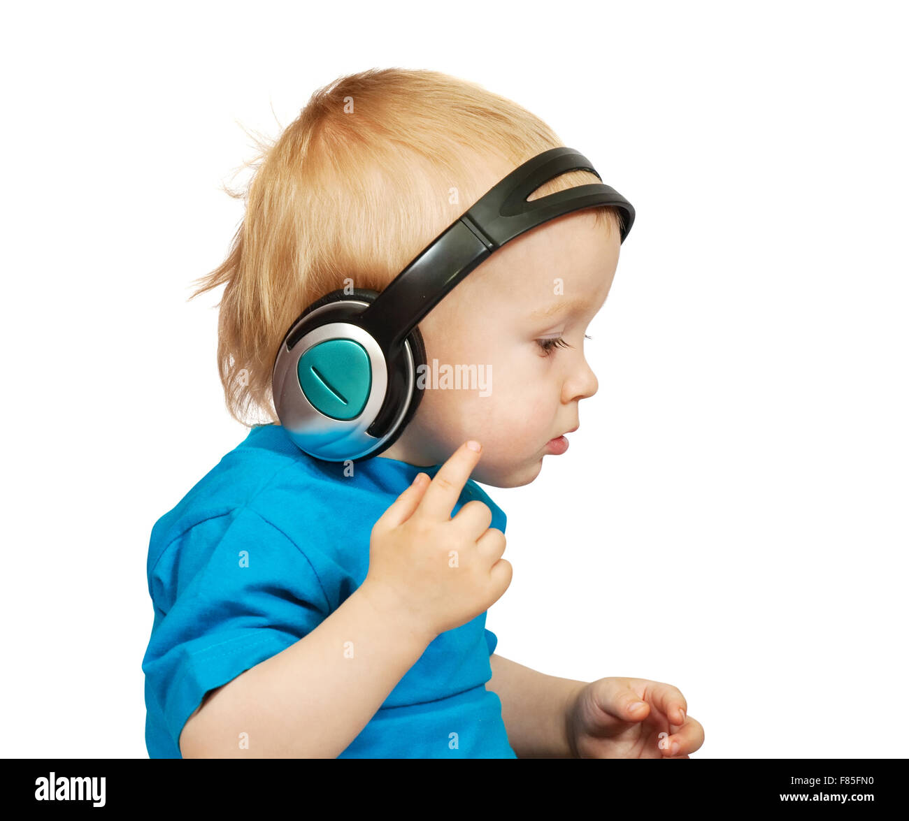 Little nice boy listening to music, isolated on white Stock Photo - Alamy