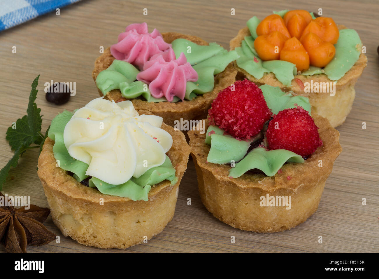 Mini jam cakes with cream in the basket Stock Photo Alamy