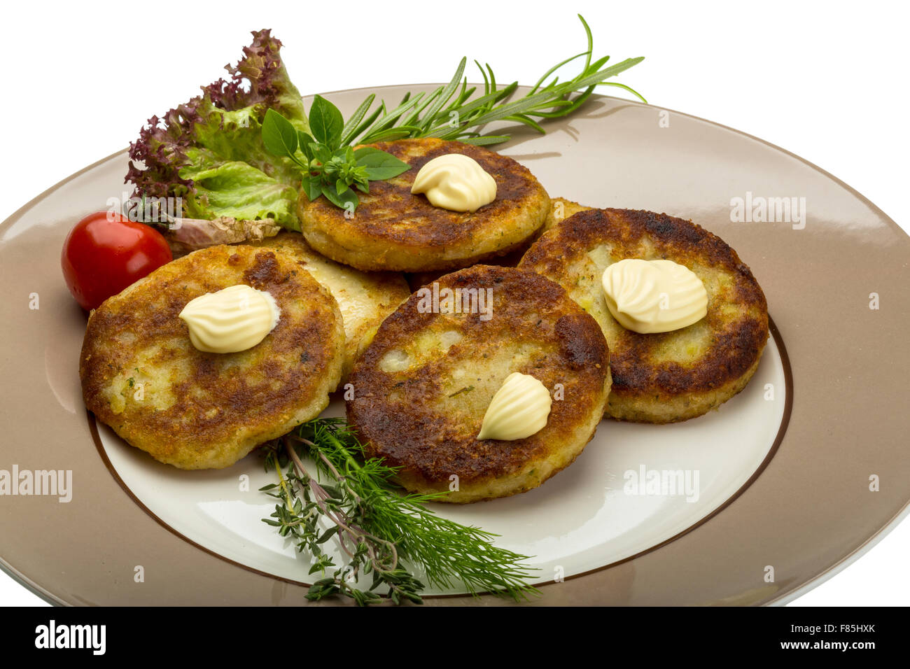 Hash browns with herbs on the plate Stock Photo Alamy