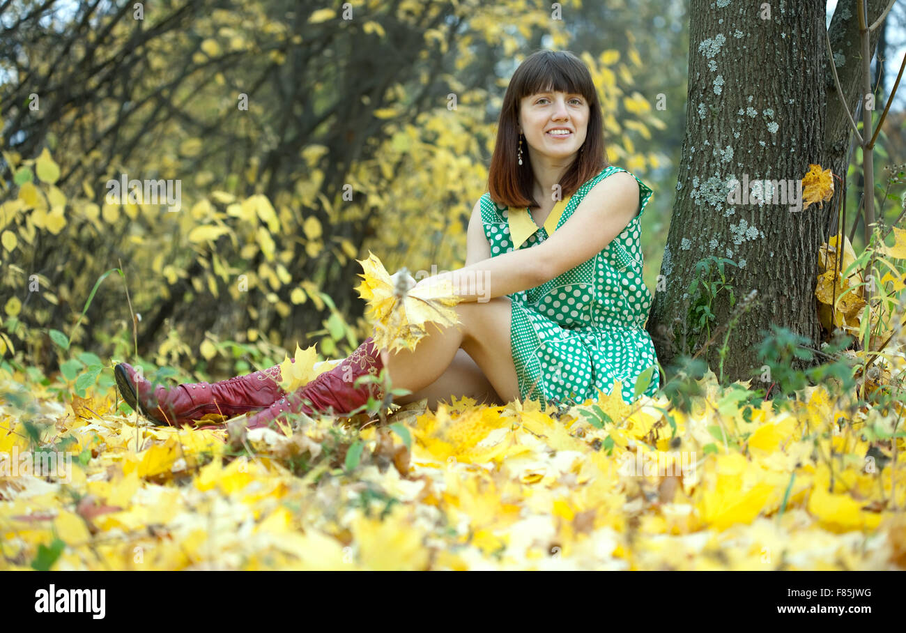 Girl in green dress at autumn park Stock Photo Alamy