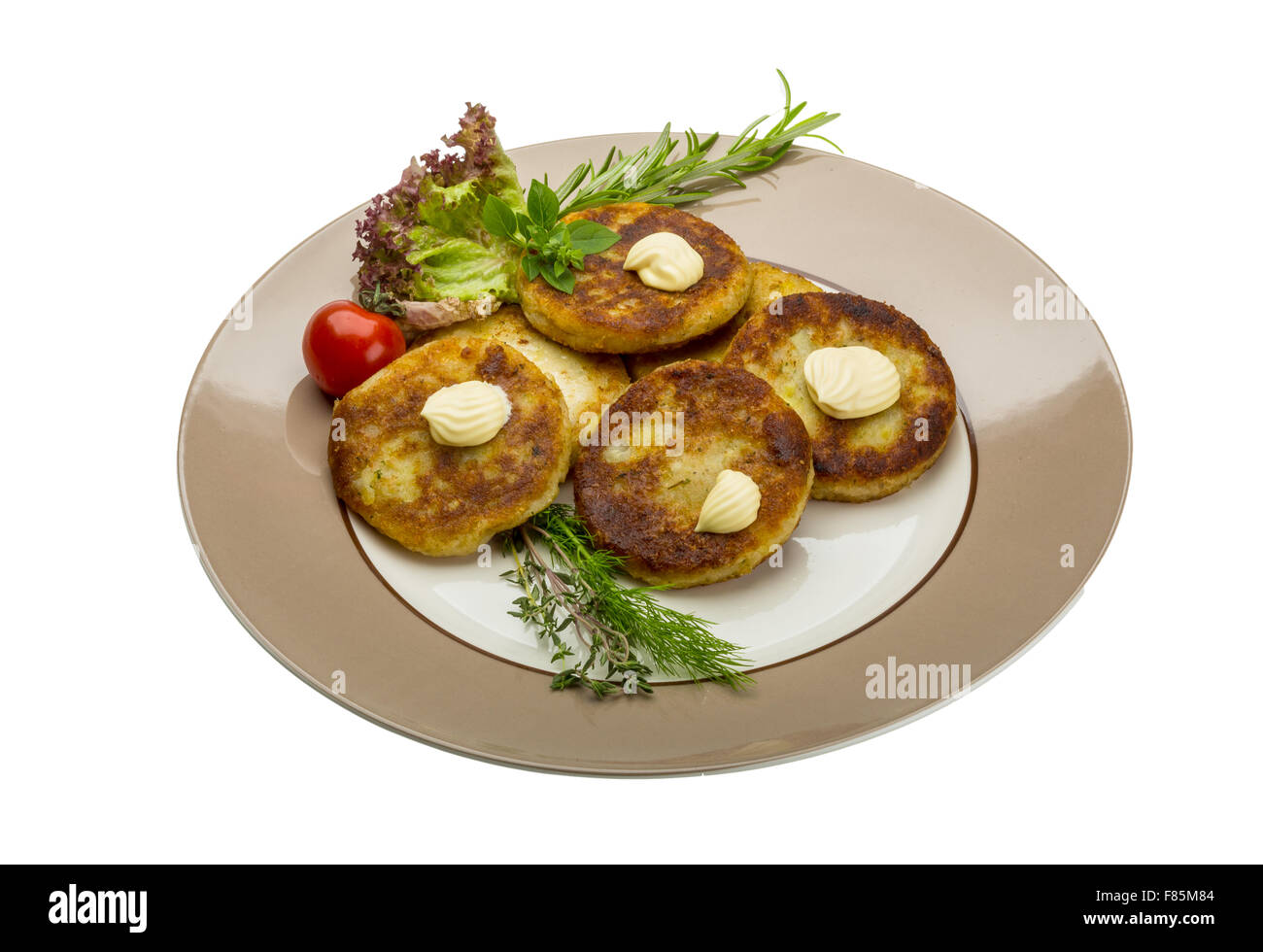 Hash browns with herbs on the plate Stock Photo Alamy