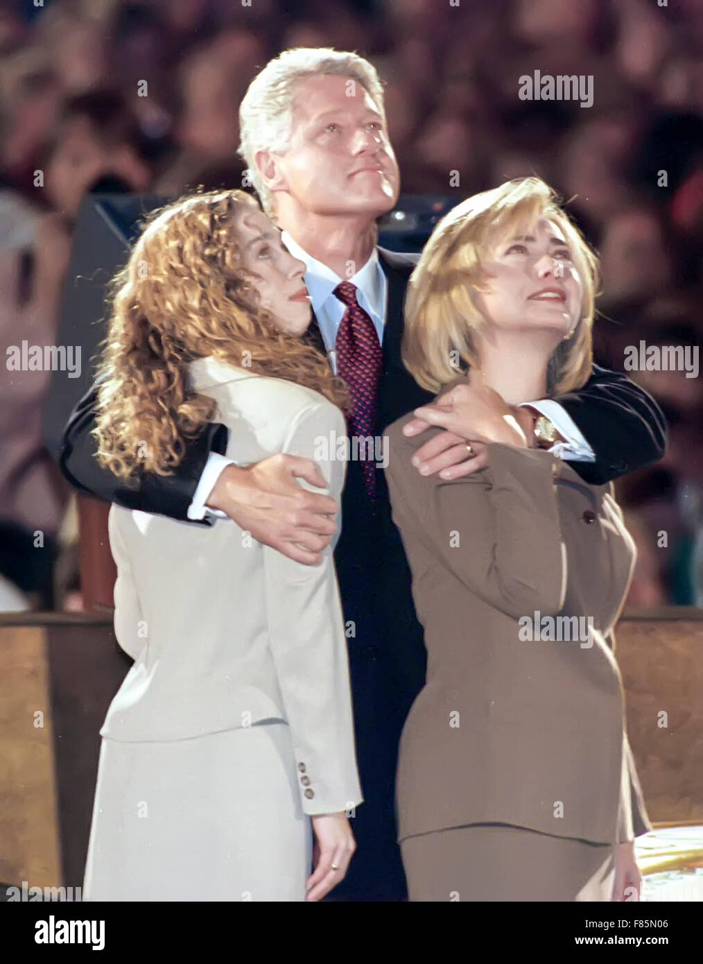 President Bill Clinton with first lady Hillary Clinton and daughter Chelsea in Little Rock, Arkansas, watching a screen confirming his re-election in 1996. Stock Photo