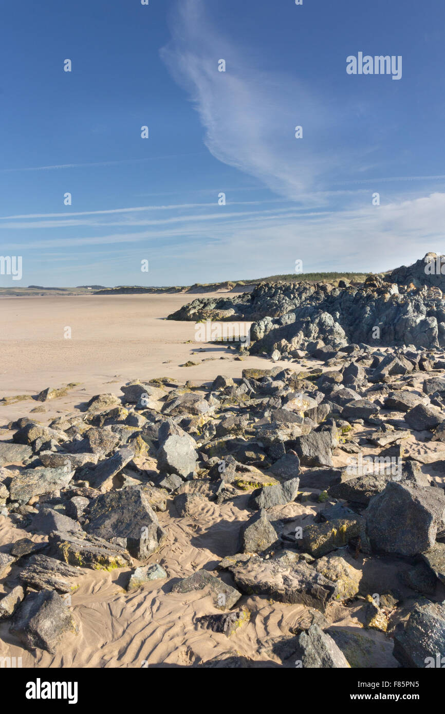 Volcanic rocks on Newborough Beach, Anglesey, Wales Stock Photo Alamy