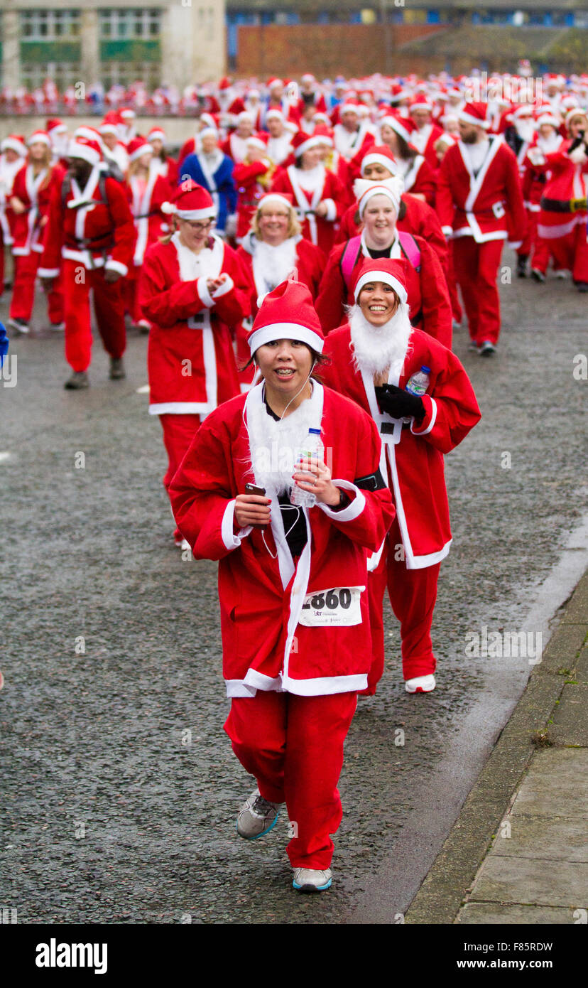 Liverpool, Merseyside, UK  6th December, 2015. The Medicash Santa Dash course starts and finishes in Liverpool city centre with a 5K route beginning at the Pier Head on Canada Boulevard in front of the Liver Buildings. It finishes in front of the Town Hall at Castle Street. Organisers of the Liverpool Santa Dash had said that they may drop the charity run due to rising council fees, with the event co-ordinators BTR Liverpool paying Liverpool City Council more than £17,000 to stage this year's race. Credit:  Mar Photographics/Alamy Live News Stock Photo