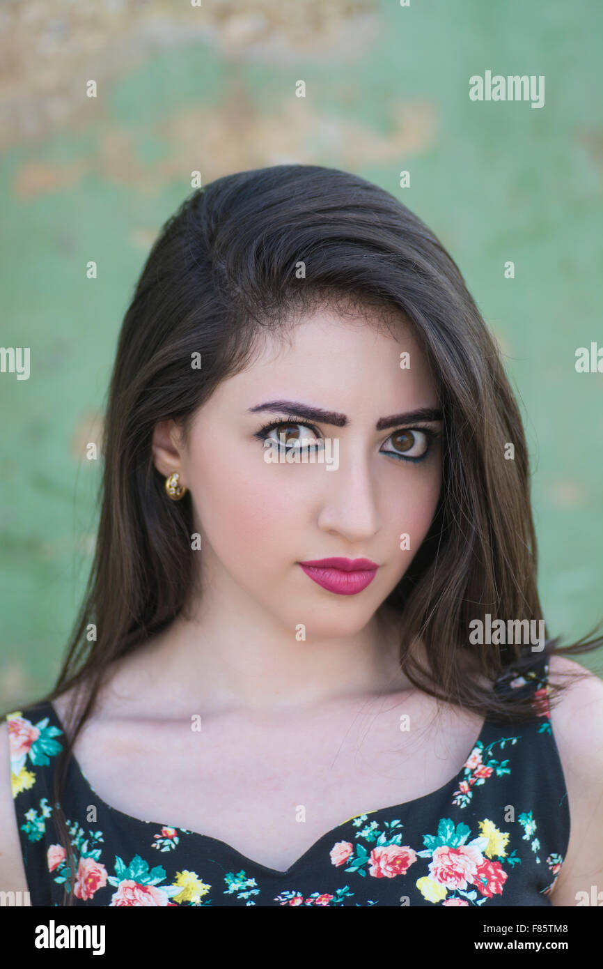 Serious young woman staring outdoors Stock Photo