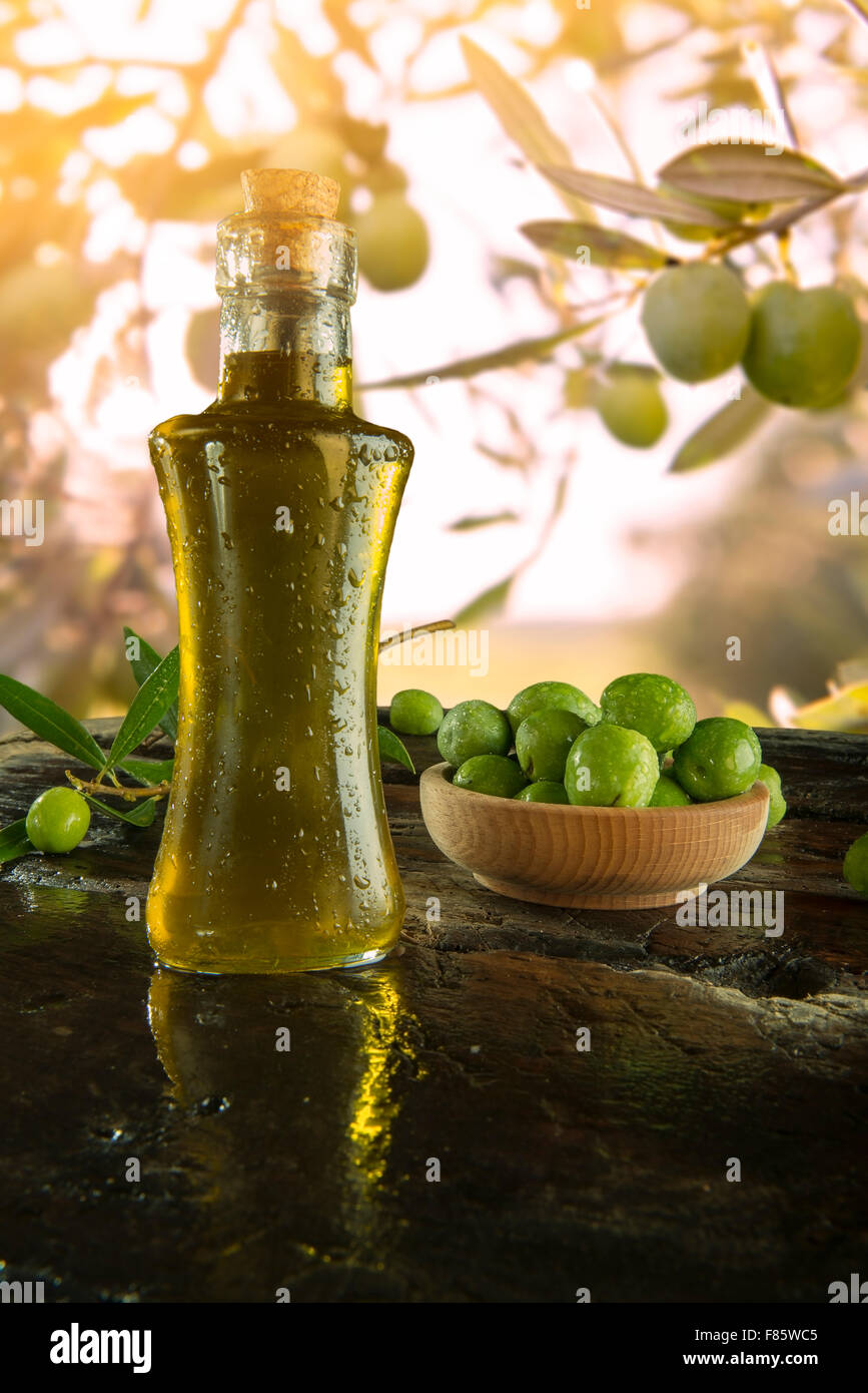 a bottle of extra virgin olive oil with Olive trees on background Stock ...