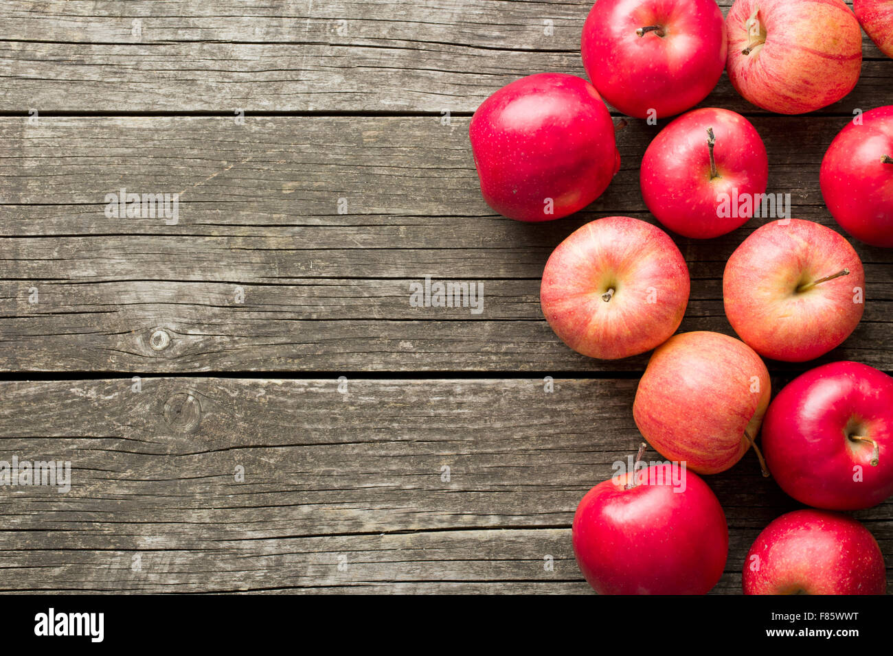 red autumn apples on old wooden table Stock Photo - Alamy