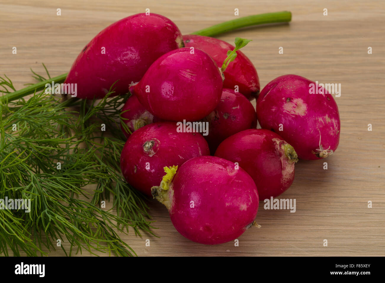 Radish with dill on the desk Stock Photo - Alamy