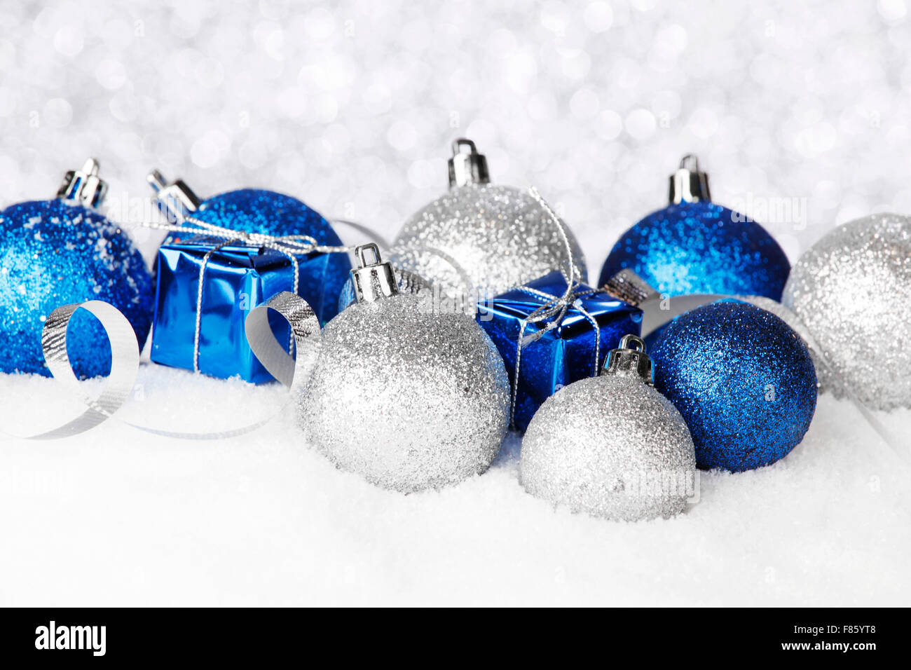 Blue and silver christmas balls and decoration on snow Stock Photo - Alamy