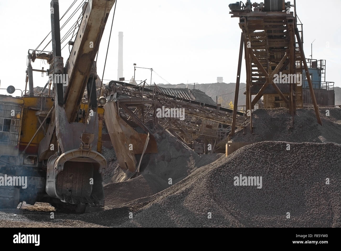 Excavator bucket gaining rubble Stock Photo - Alamy