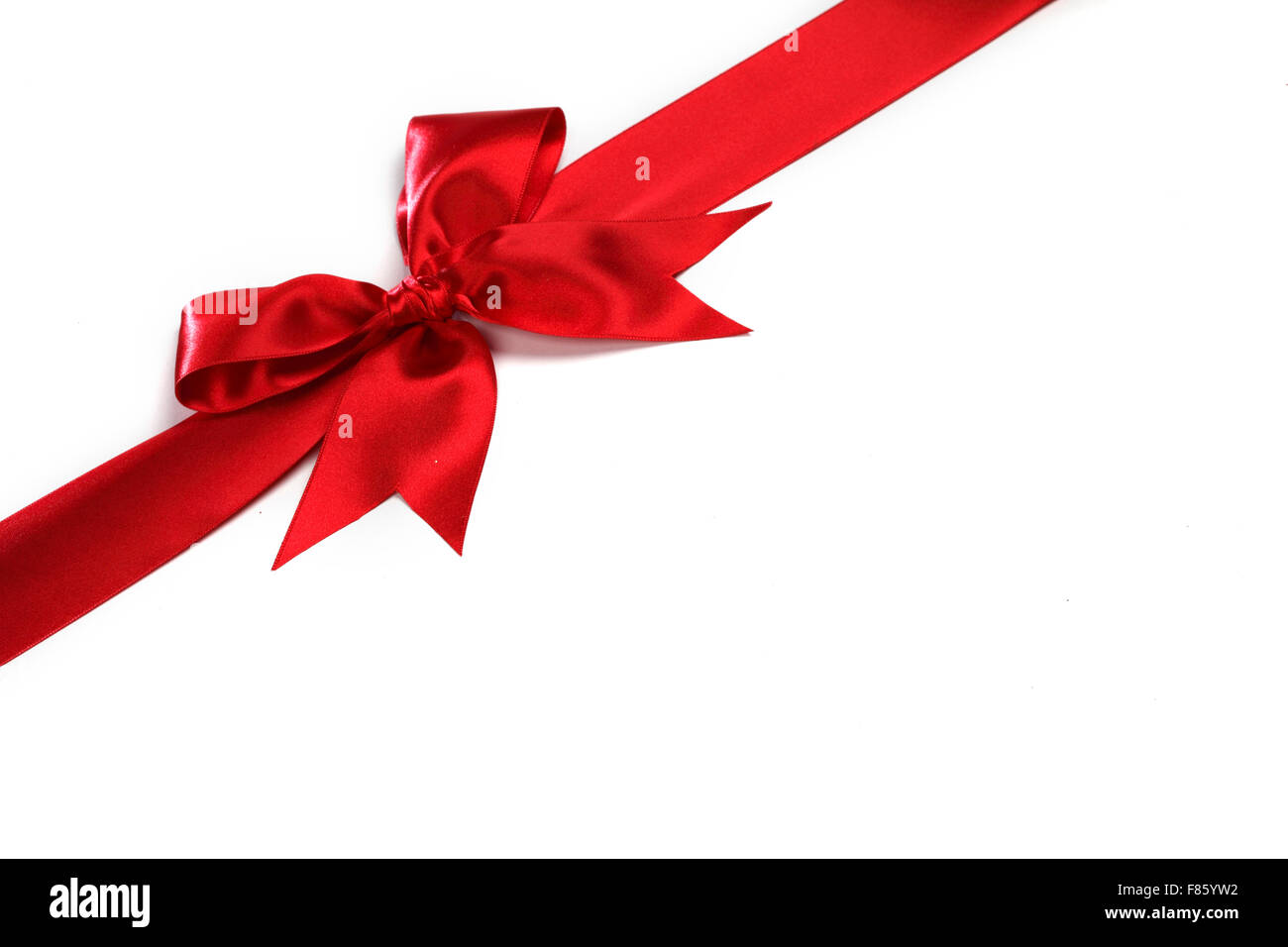 Decorative red satin bow isolated on white background Stock Photo - Alamy