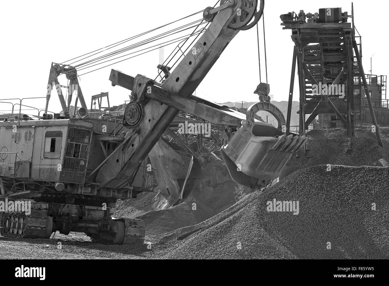 Excavator bucket gaining rubble Stock Photo - Alamy