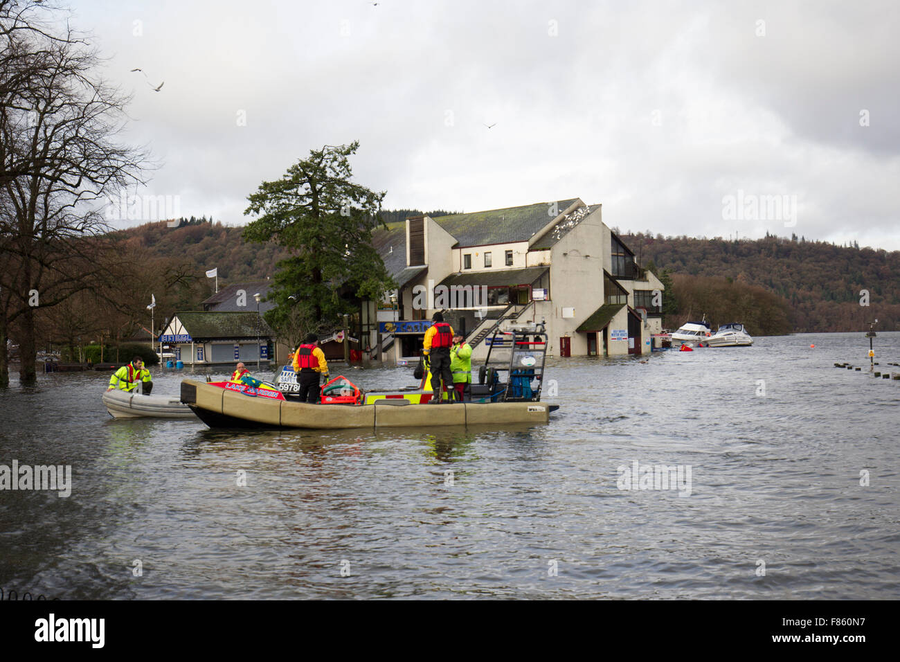 Lake Windermere, Cumbria, UK. 6th Dec, 2015. Severe flood. Lake Windermere flooded over to record high -for a few hours above the previous record  Bowness Bay Sunday morning promenade and main road flooded. Windermere Lake Cruises &  Lake Warden rescue elderly lady stuck at Royal Grange on Lake Windermere who has cancer is is running out of drugs & needs to be in hospital a Newcastle this afternoon Credit:  Gordon Shoosmith/Alamy Live News Stock Photo