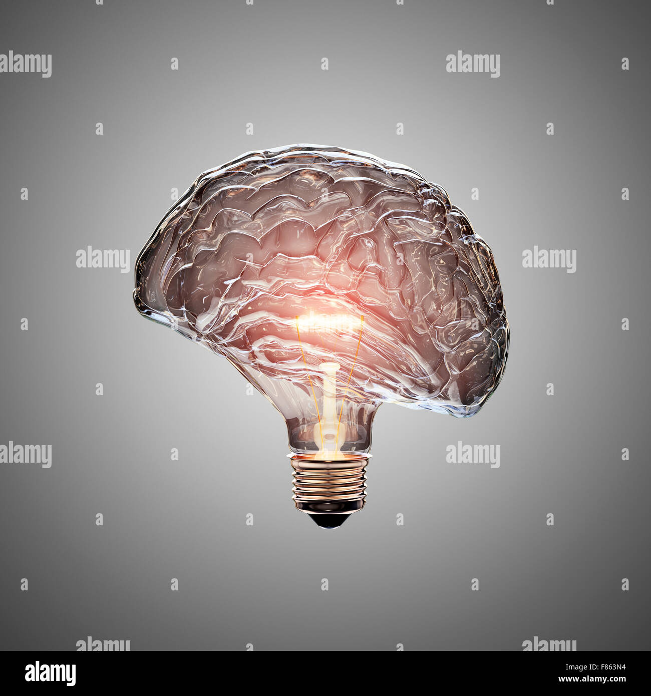 Glowing Light Bulb with the glass shaped as a Brain. This 3D image is conceptual of an active, creative, thinking mind or idea Stock Photo