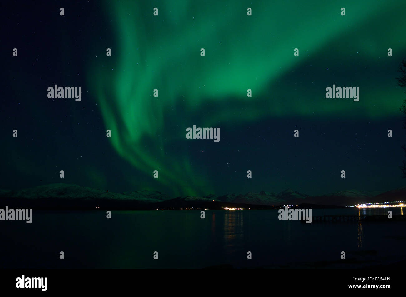 beautiful aurora borealis over fjord landscape Stock Photo - Alamy