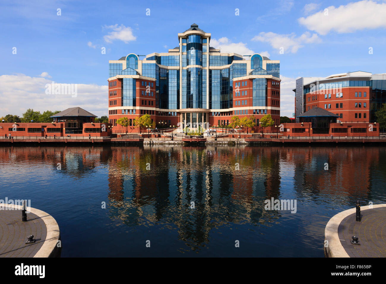Victoria Harbour building from Mariner's Canal in redeveloped dockland. Salford Quays Greater Manchester England UK Britain Stock Photo