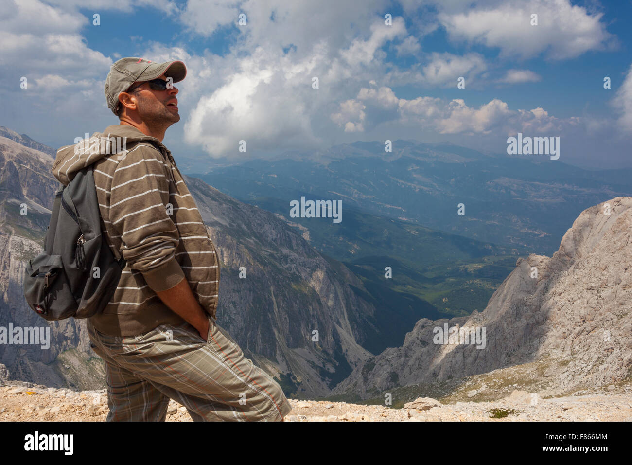 Man hiking up a mountain Stock Photo - Alamy