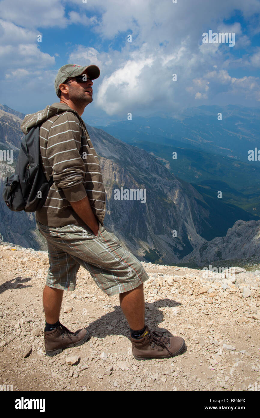 Man hiking up a mountain Stock Photo - Alamy