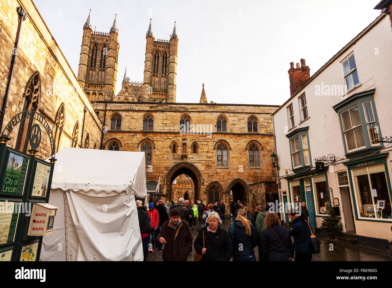 Lincoln Christmas Market 06/12/2015 Lincolnshire England UK visitors flock to see the market stalls selling their goods food stall sell snacks in front of the Cathedral in the City Stock Photo