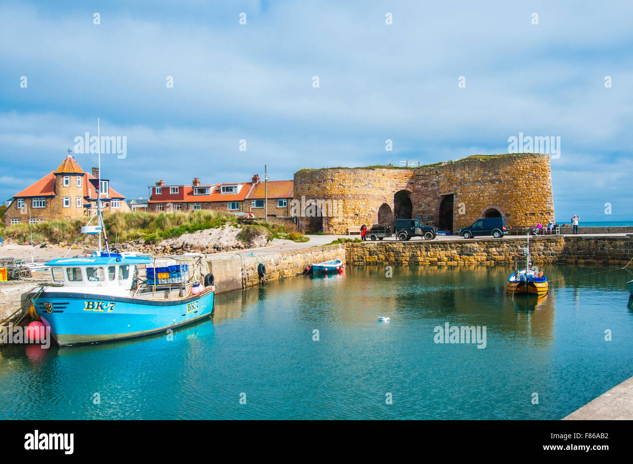 fishing boats moored up in Beadnell Harbor Northumberland  Ray Boswell Stock Photo