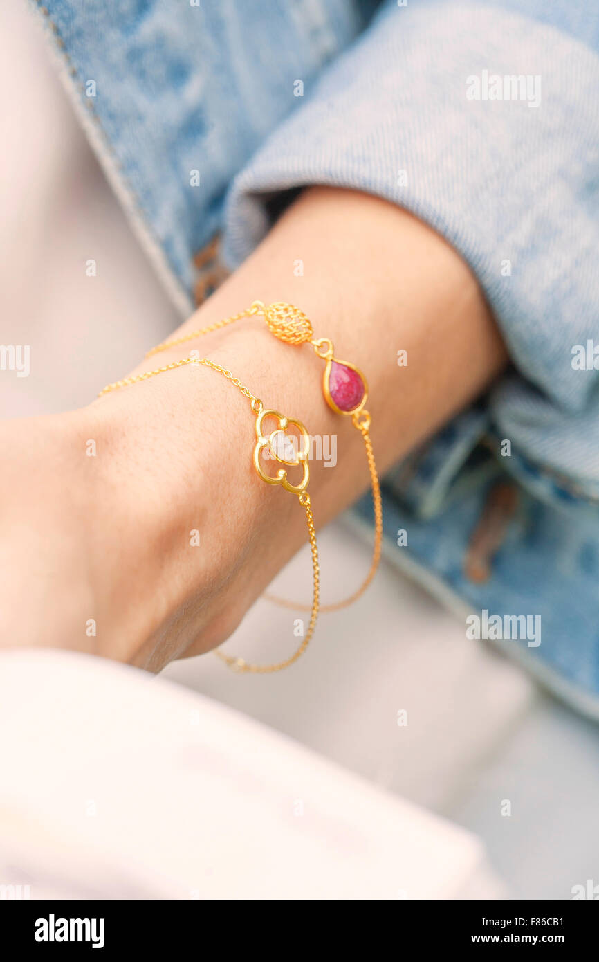 Woman wearing bracelets hi-res stock photography and images - Alamy