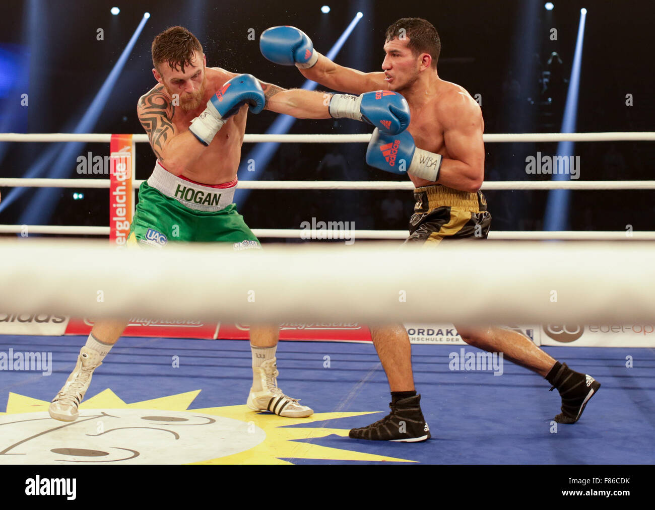 05.12.2015. Hamburg, Germany.  WBA Super welterweight worldchampionships. Jack Culcay of Germany and Dennis Hogan of Ireland swap punches during the WBA World Championship title fight at Inselparkhalle on December 5, 2015. Culcay won on points. Stock Photo