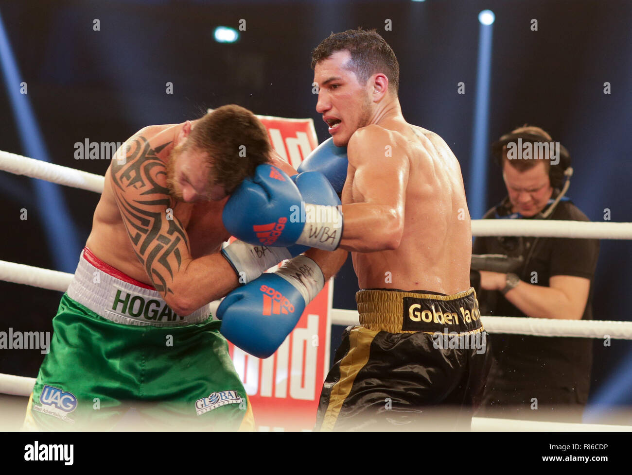 05.12.2015. Hamburg, Germany.  WBA Super welterweight worldchampionships. Jack Culcay of Germany and Dennis Hogan of Ireland swap punches during the WBA World Championship title fight at Inselparkhalle on December 5, 2015. Culcay won on points. Stock Photo
