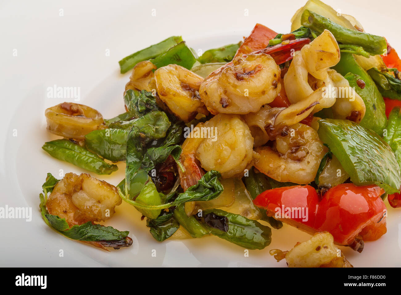 Seafood with vegetables - shrimps and calamari Stock Photo - Alamy