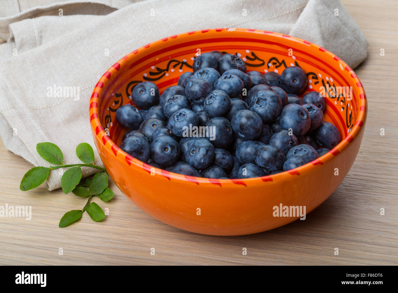 Blueberry with leaves in the bowl Stock Photo Alamy