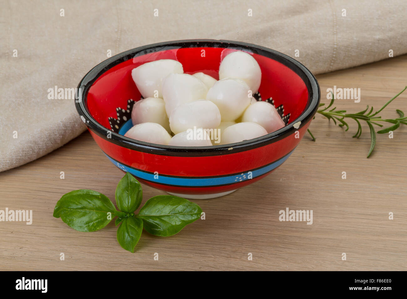 Mozzarella cheese balls in the bowl on desk Stock Photo Alamy