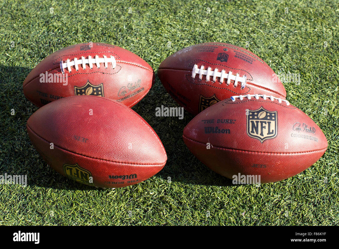 East Rutherford, New Jersey, USA. 6th Dec, 2015. Four NFL footballs sit