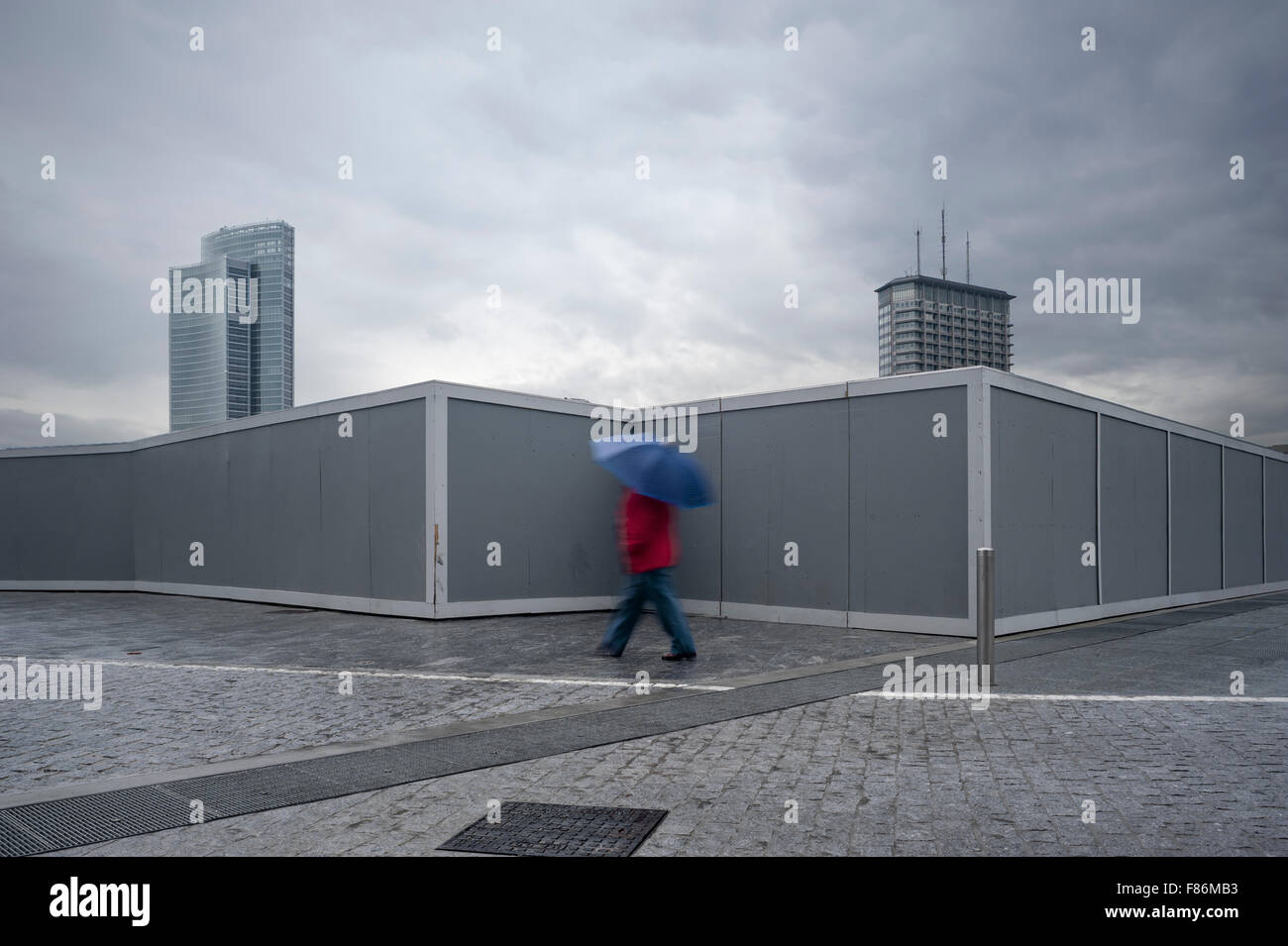 Milan, Italy. Man walking under the rain Stock Photo
