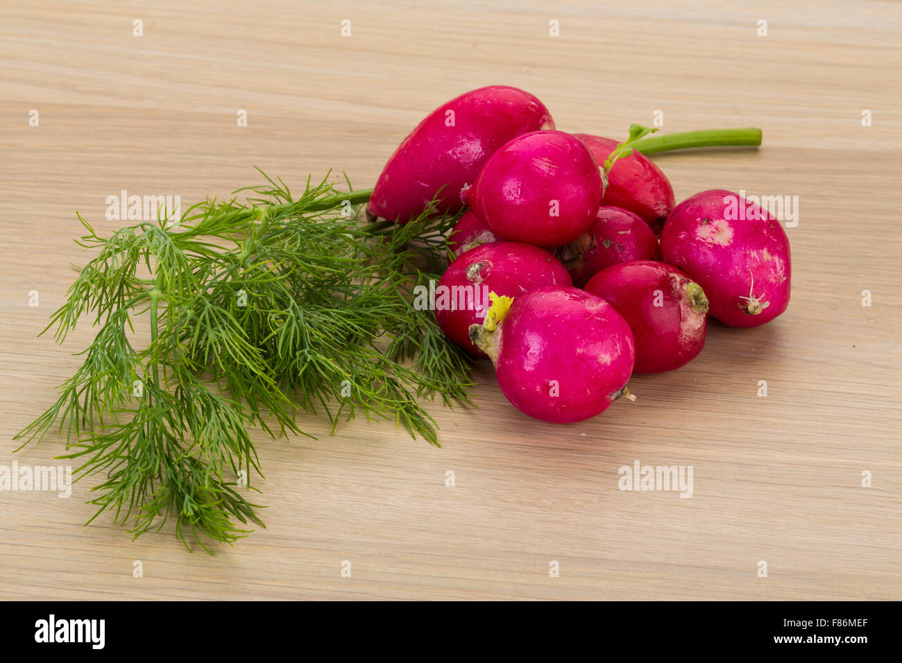 Radish with dill on the desk Stock Photo - Alamy