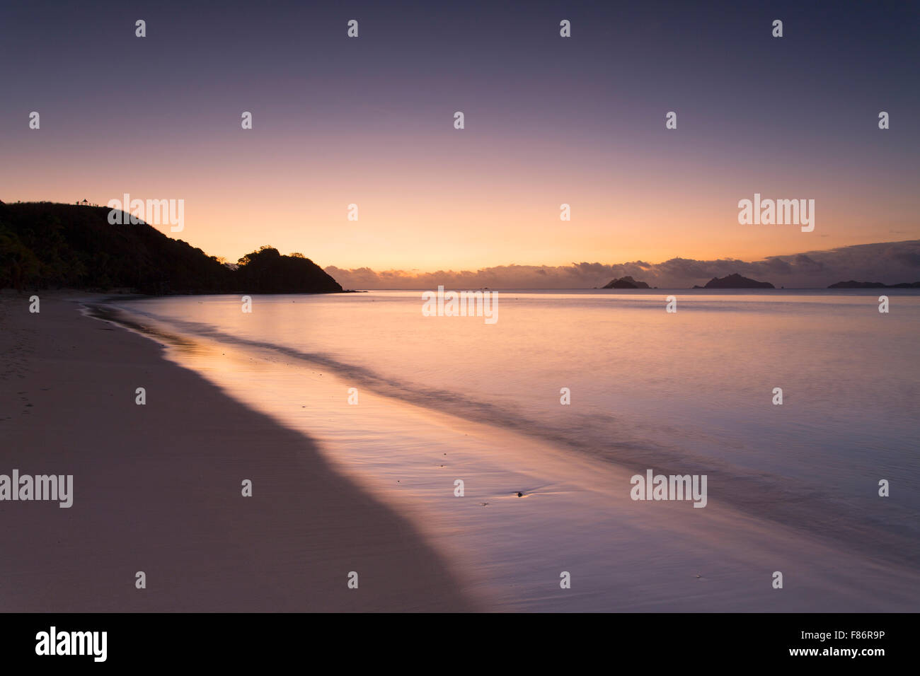 Mana Island at sunset, Mamanuca Islands, Fiji Stock Photo