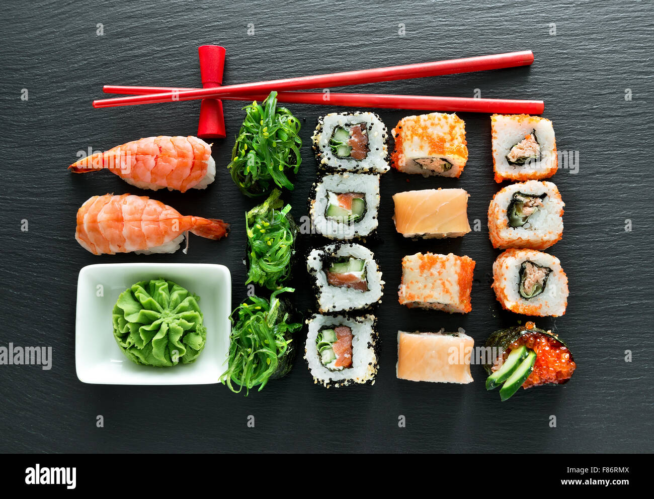Set of sushi with wasabi and chopsticks on slate Stock Photo