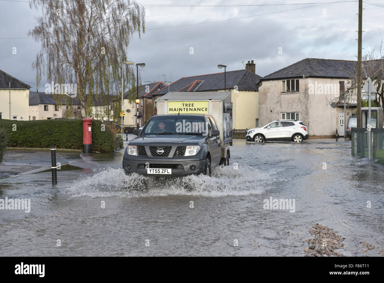 Kendal, UK. 06th Dec, 2015. A 4x4 makes its way through Sandylands in