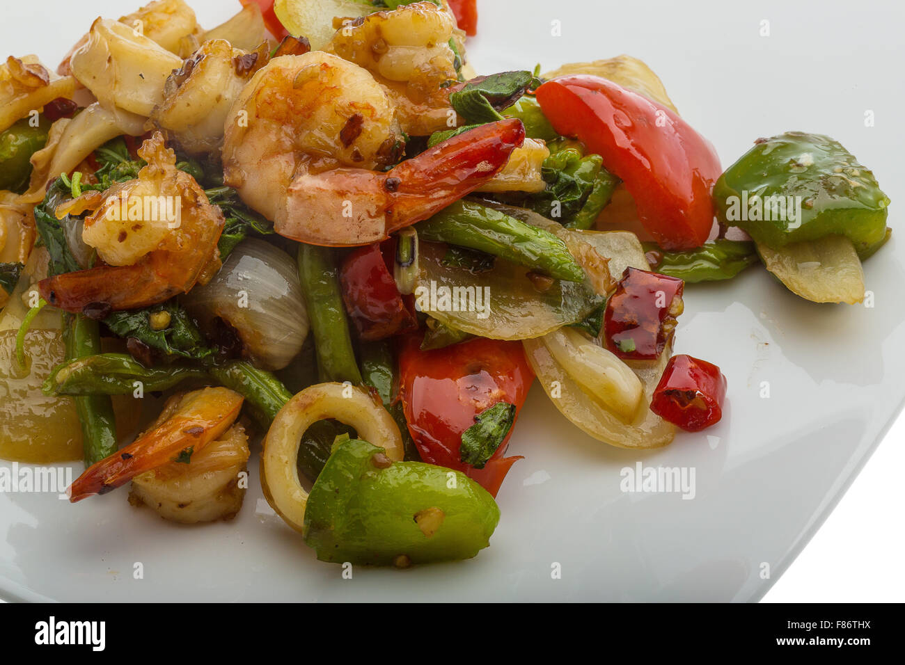 Seafood with vegetables - shrimps and calamari Stock Photo - Alamy