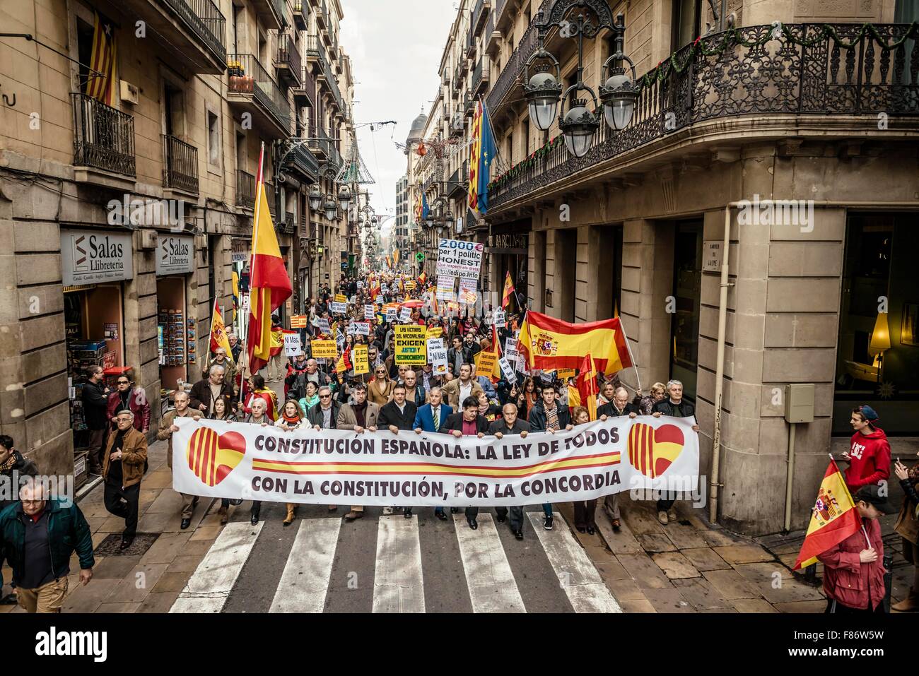 Barcelona, Spain. 06th Dec, 2015. Demonstrators holding placards march behind their banner for the indissoluble unity of the Spanish nation and against a hypothetical independence of Catalonia on the Spanish constitution day. Credit:  matthi/Alamy Live News Stock Photo